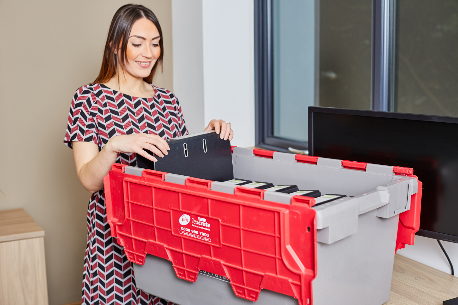 A woman putting items on container