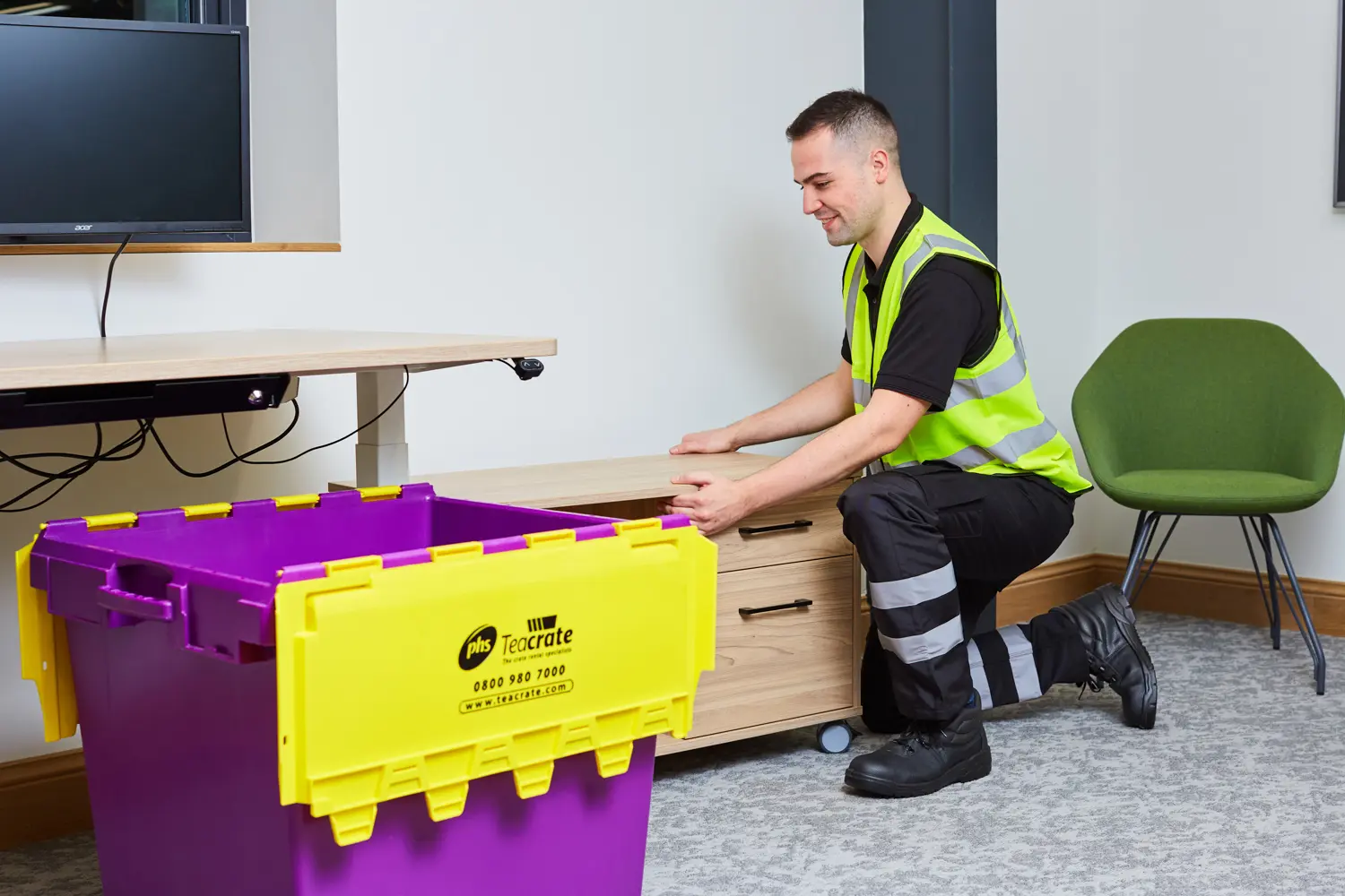 A man dragging a small table